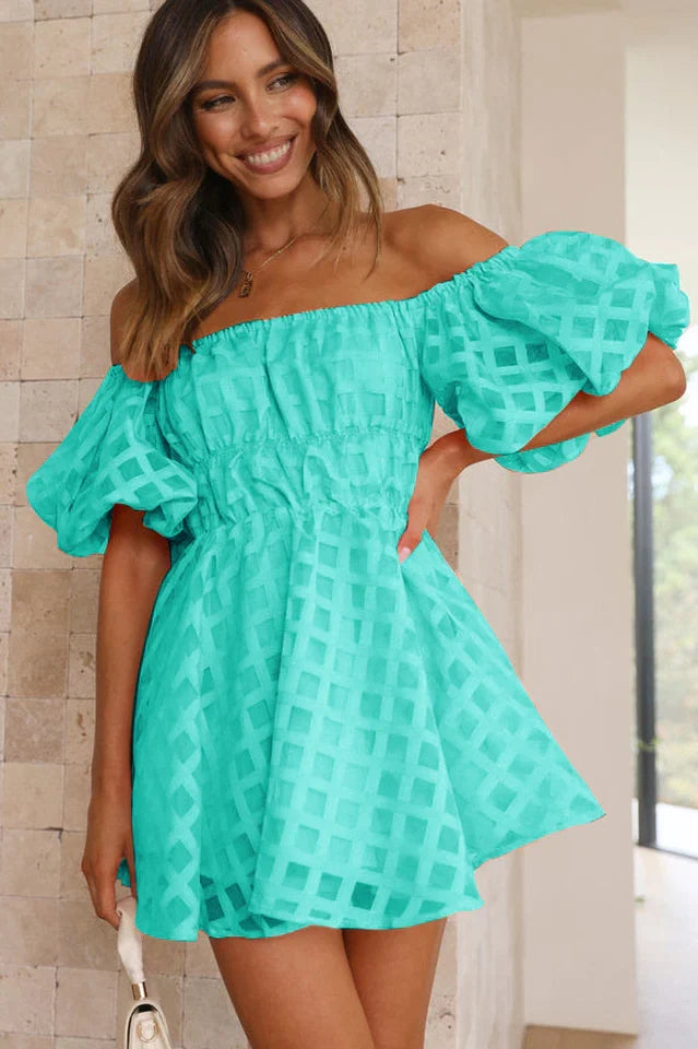 Short women's cocktail dress, featuring stylish puff sleeves, perfect for special events.