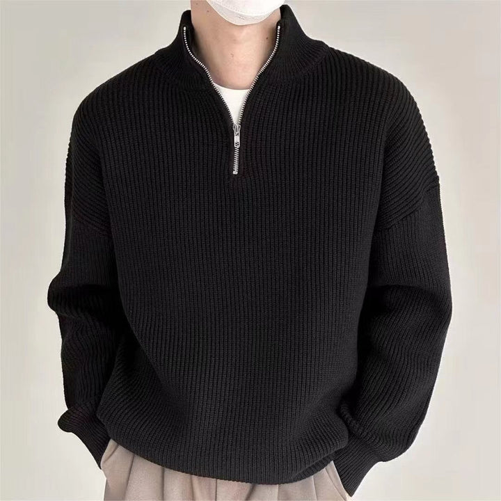 Stylish men's ribbed knit quarter-zip sweater with a stand collar, offering effortless style and comfort.