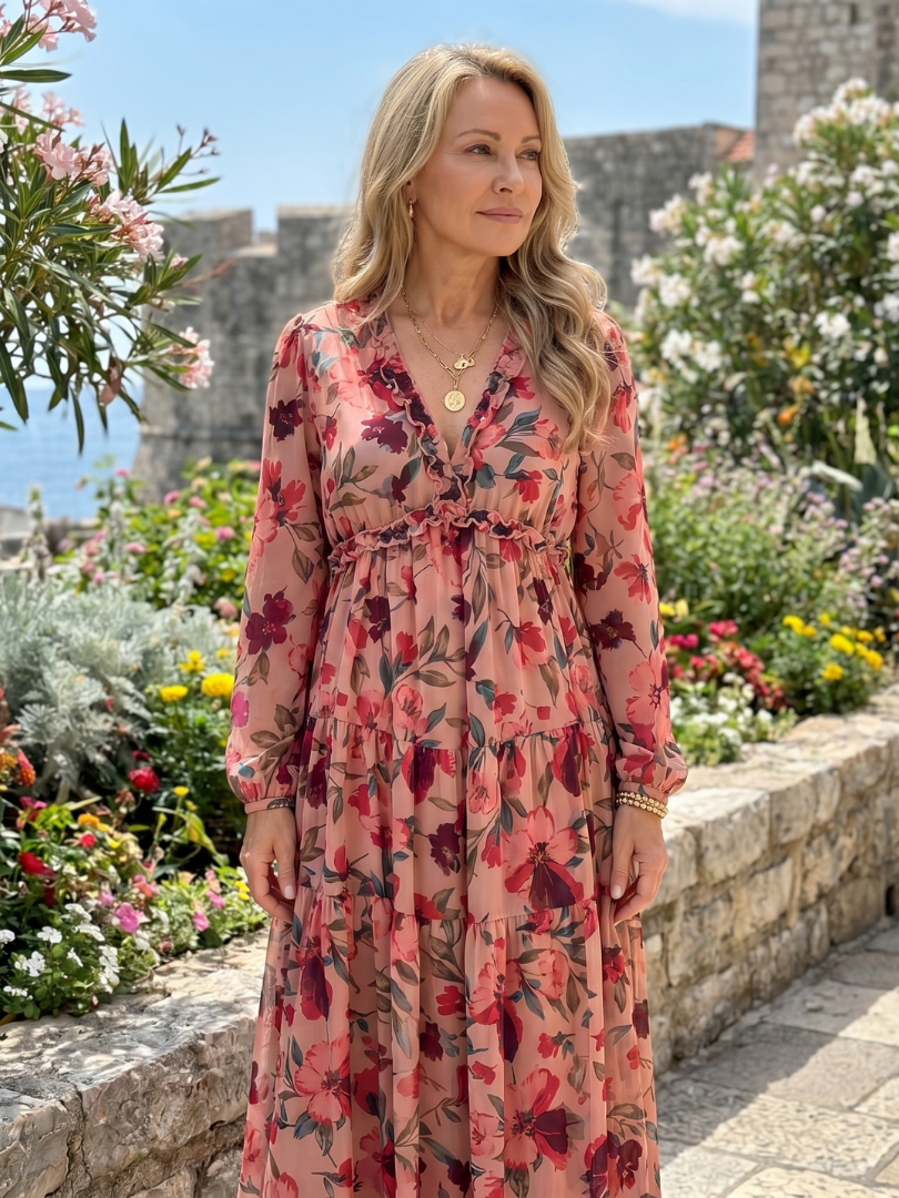 Comfortable women's floral tiered maxi dress with long sleeves, ideal for stylish spring fashion.