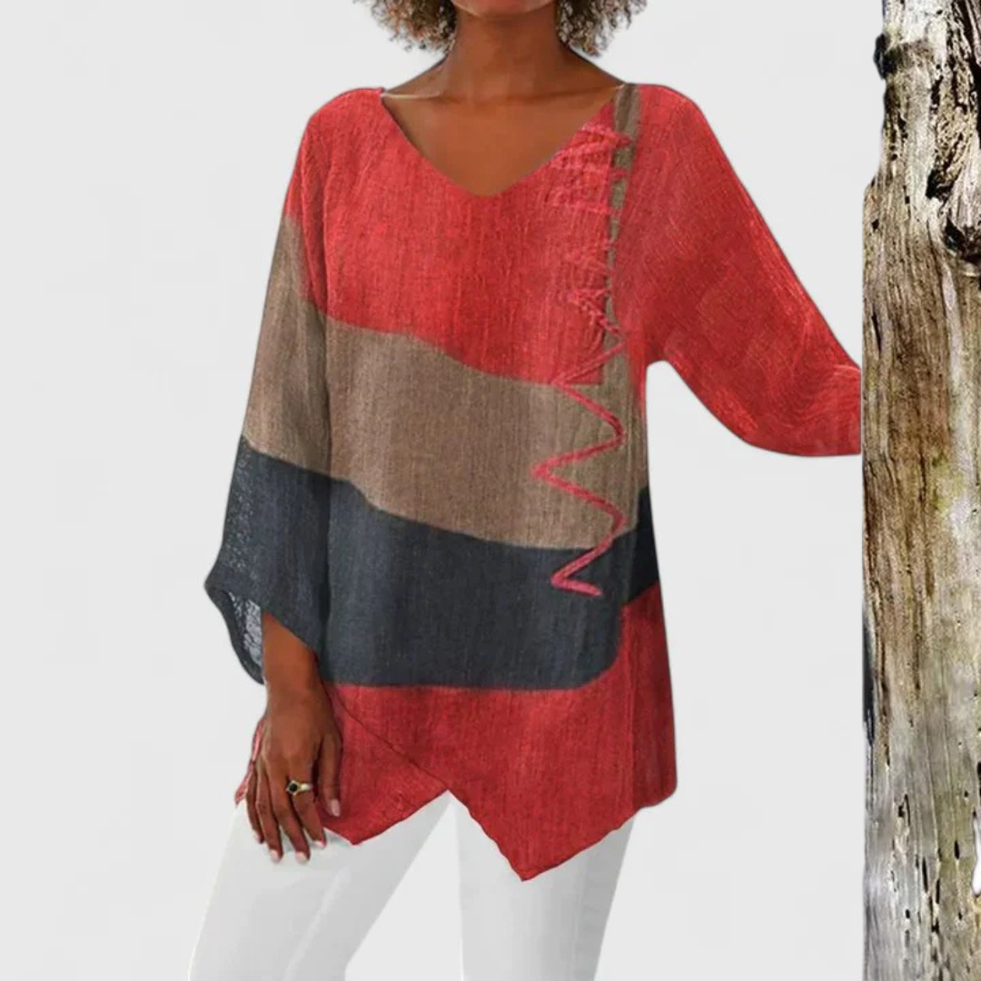 Women's sophisticated V-neck tunic top with unique asymmetrical brushstroke print, perfect for casual spring fashion.
