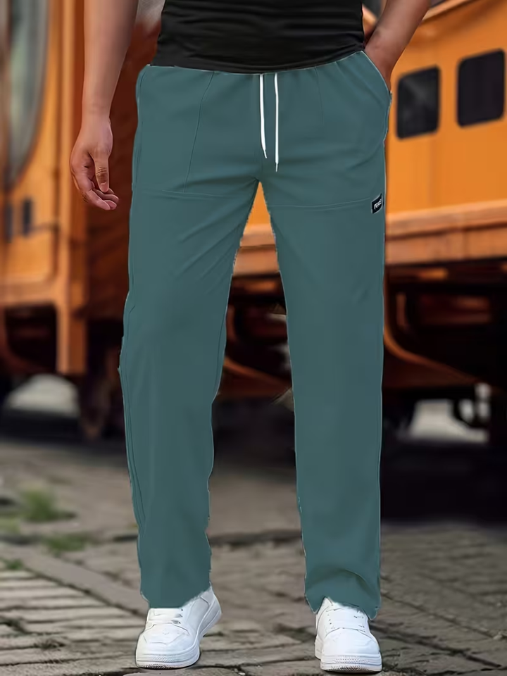 Stylish men's straight-leg pants in a neutral shade, offering comfort and classic style for any occasion.