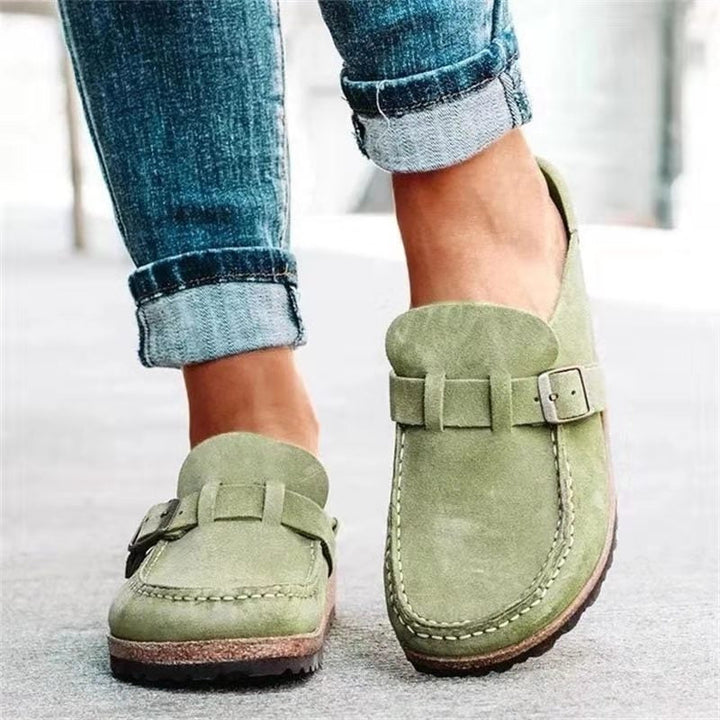 Woman wearing ergonomic orthopaedic slip-ons, enjoying everyday walking comfort & support with shock absorption.
