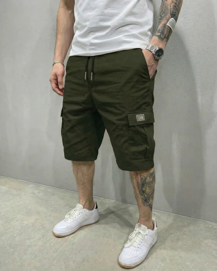 Comfortable men's utility shorts with adjustable drawstring waist & practical cargo pockets for relaxed, casual wear.
