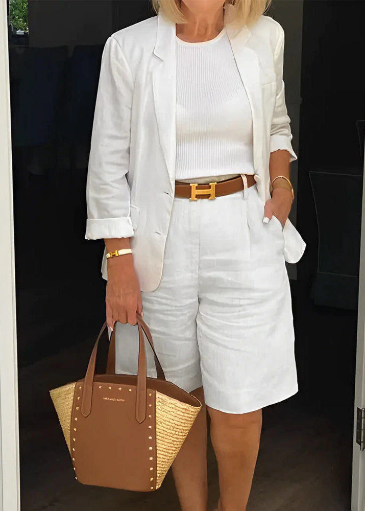 Stylish women's two-piece set: blazer, sleeveless top & knee-length shorts. Versatile for summer office or casual chic.