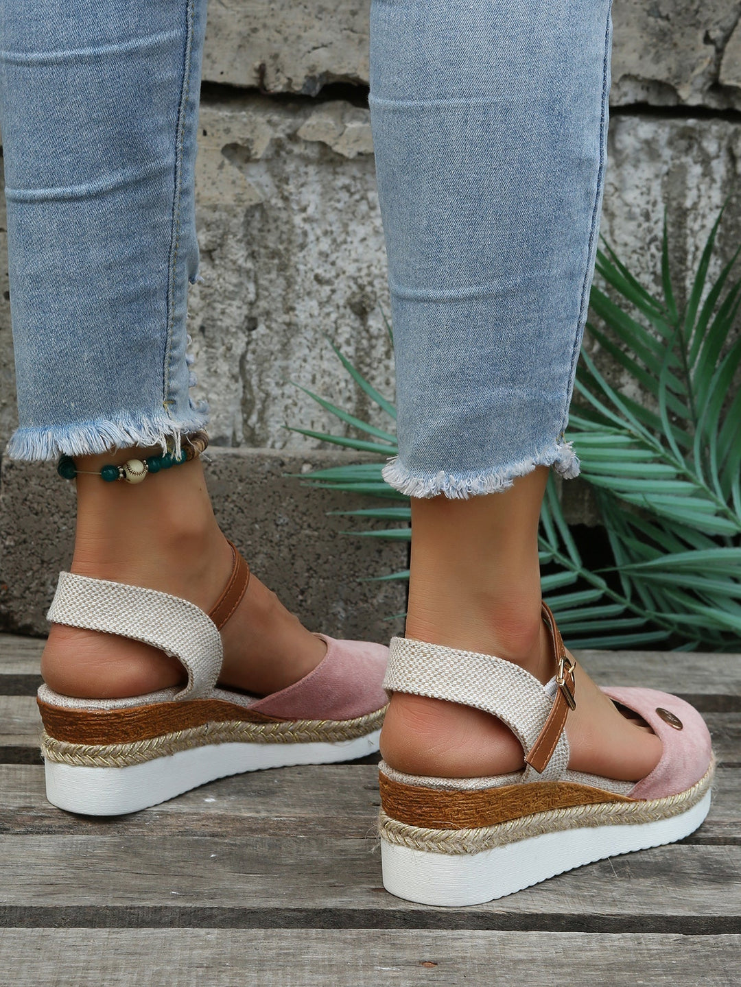 Close-up of women's casual woven sandals, showcasing orthopedic comfort features and soft cushioned sole.