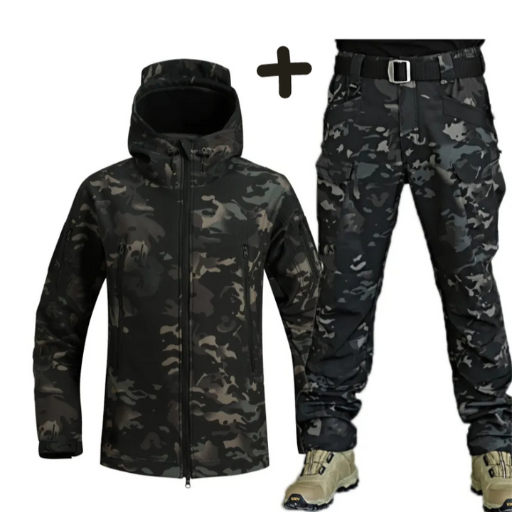 Close-up of material detail on men's tactical hooded jacket & cargo pants, highlighting rugged design.