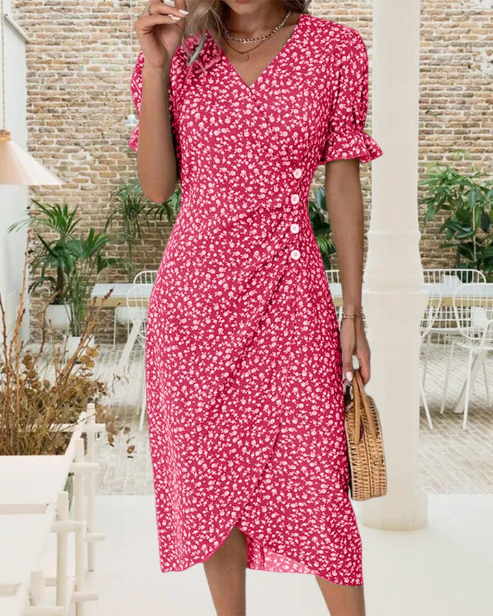 Women's floral wrap midi dress with V-neck and button detail, elegant and chic for any event.