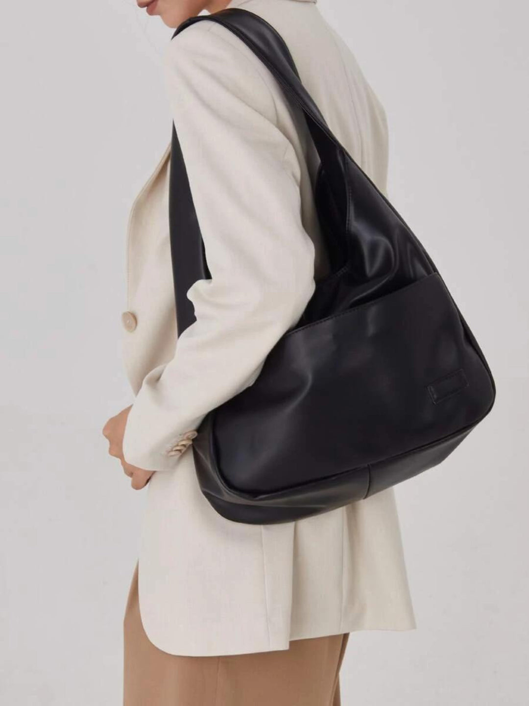 Front view of a women's vegan leather everyday shoulder bag. A versatile tote for work, school, and daily use.