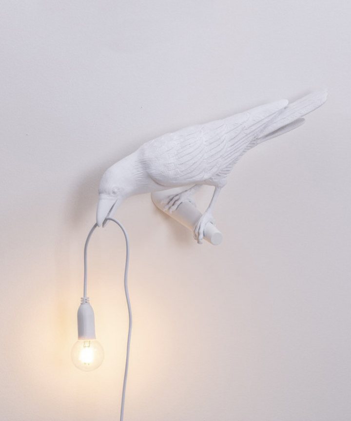 Modern crow accent lamp, a stylish table light for contemporary interior design and unique spaces.