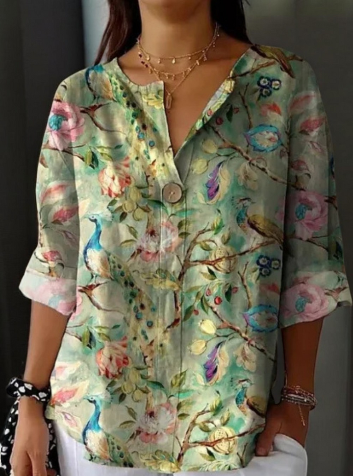 Feminine floral patterned blouse for women. Elegant shirt, great for spring, summer, and casual chic outfits.