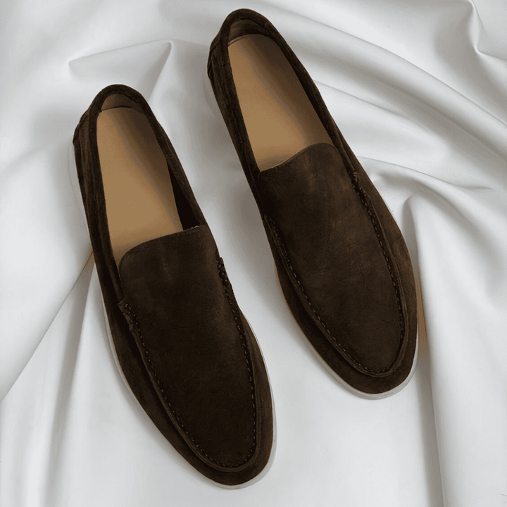 Black slip-on loafers for men, ideal for office or formal wear, combining style & comfort.