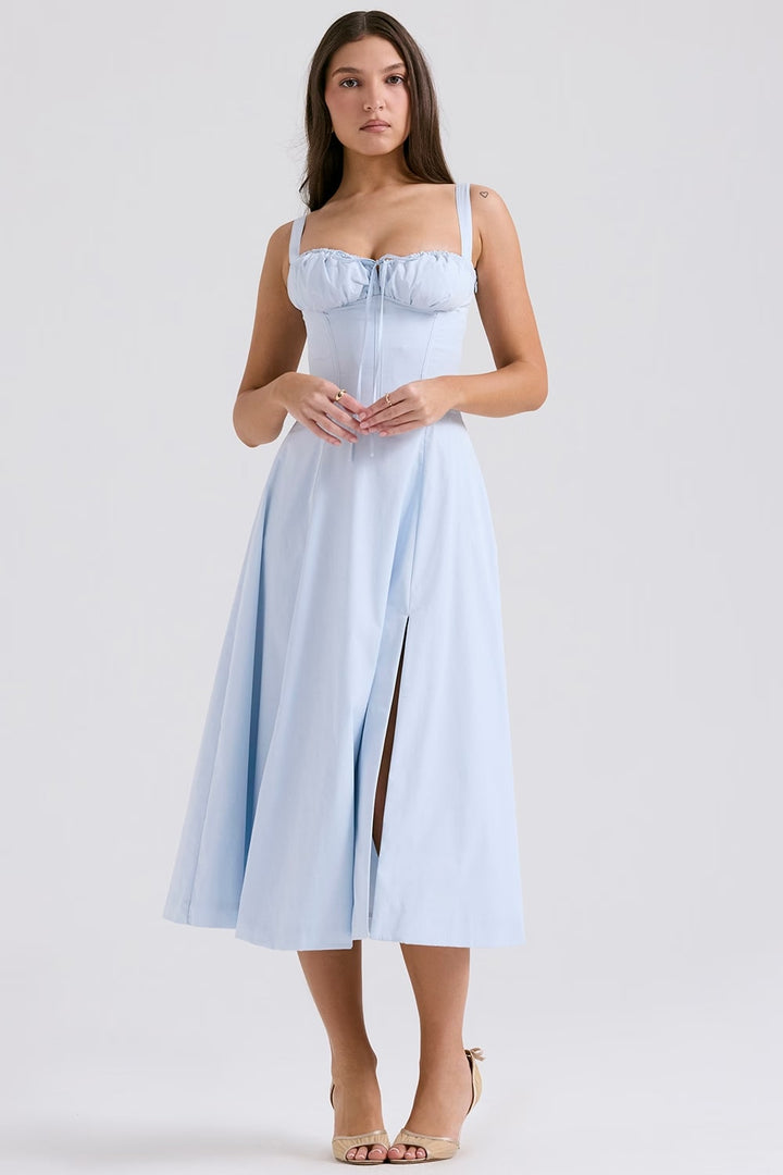Side profile of a sophisticated blue lace-up corset midi dress. Ideal women's party wear.