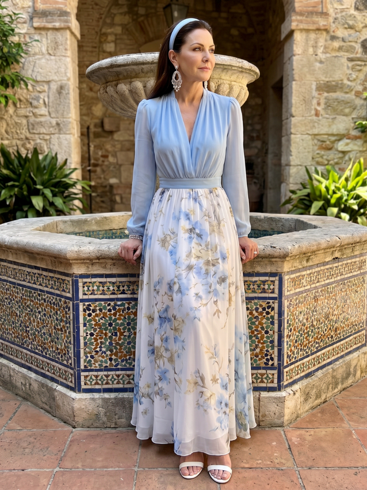 Beautiful women's floral maxi dress in sky blue with sheer V-neck bodice & sleeves, ideal for elegant parties.