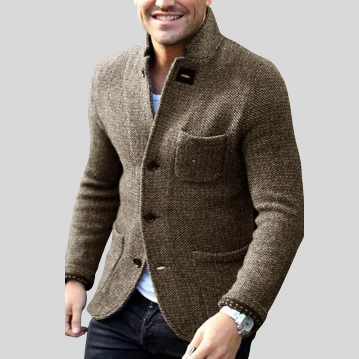 Versatile men's quilted blazer, ideal for business casual or stylish winter outerwear, featuring a button front.