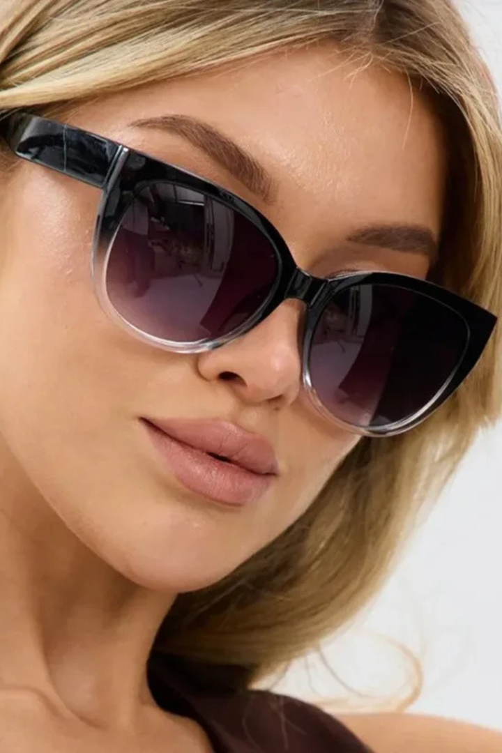 Elegant oversized cat-eye sunglasses for women, showcasing a trendy gradient frame, a must-have fashion accessory.