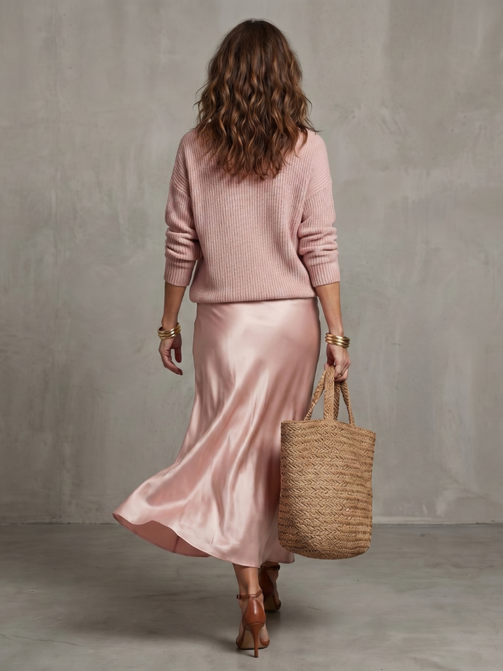 Matching women's long sleeve sweater and midi skirt set. Elegant, versatile, and comfortable fall outfit.