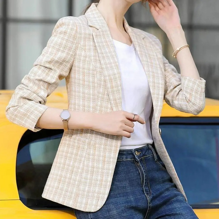 Sophisticated pink women's tailored blazer with a single button, ideal for office and professional wear.