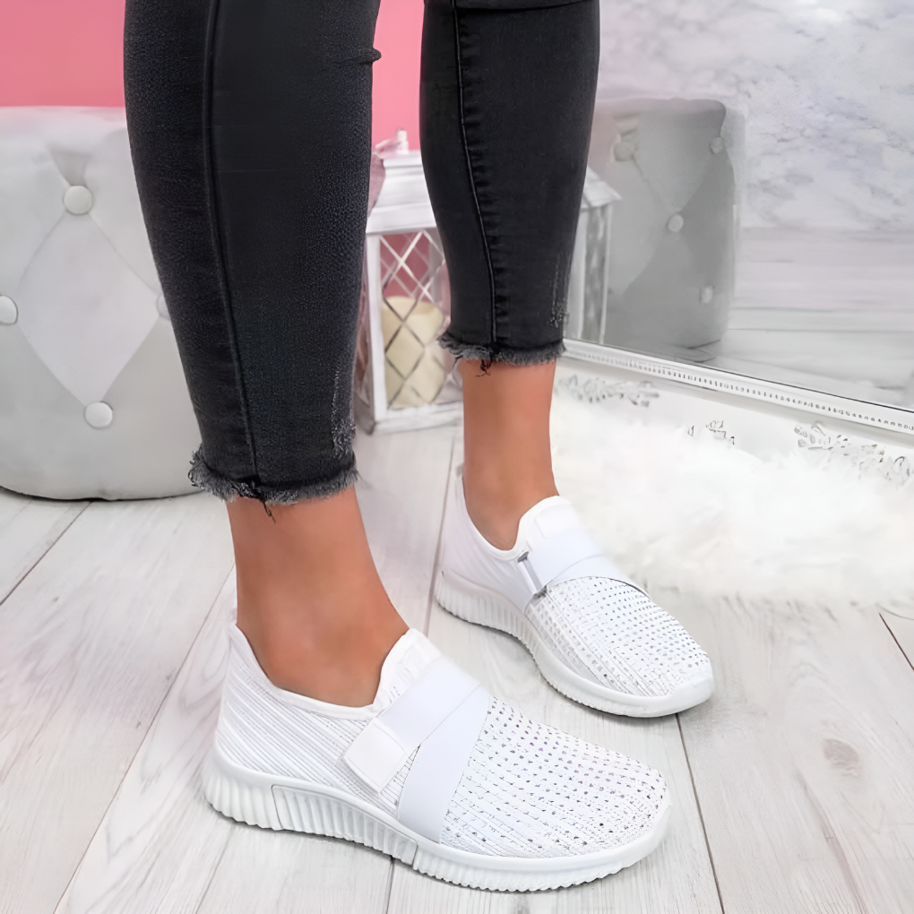 Close-up of elastic strap on women's slip-on trainers. Easy-wear athletic sneakers designed for comfort and style.