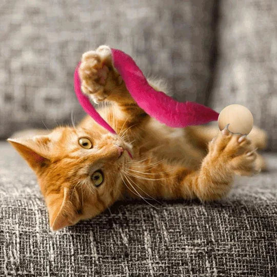 Stimulating interactive cat toy with wagging tail & bell, designed for active feline playtime and exercise.