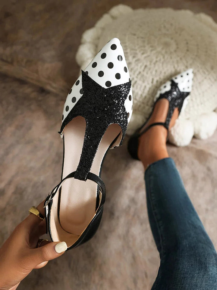 Stylish women's T-bar ballet flats with a unique polka dot pattern. Elegant and comfortable fashion shoes for women.