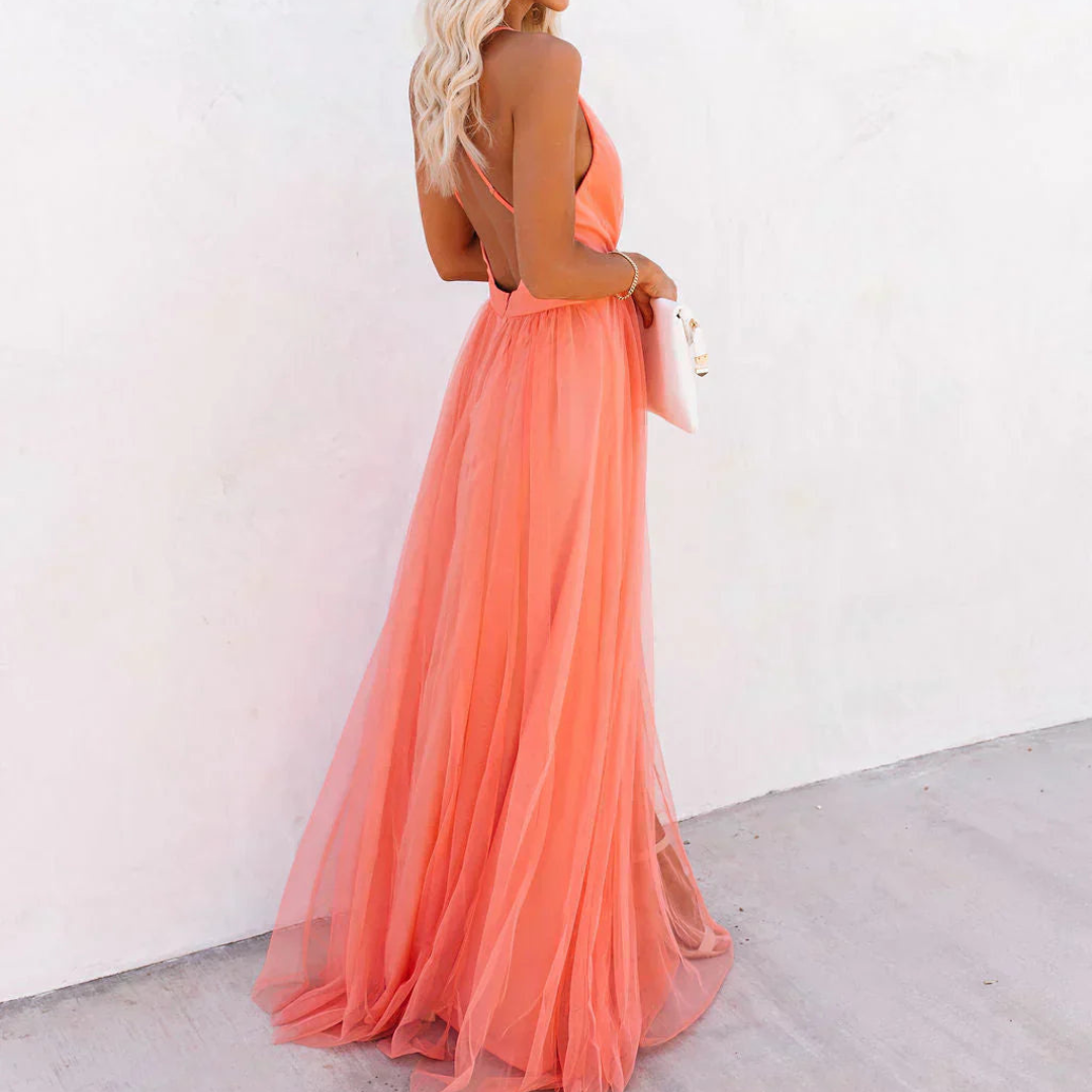 Women's long coral flowy dress, offering an elegant silhouette and comfortable fit for formal events.