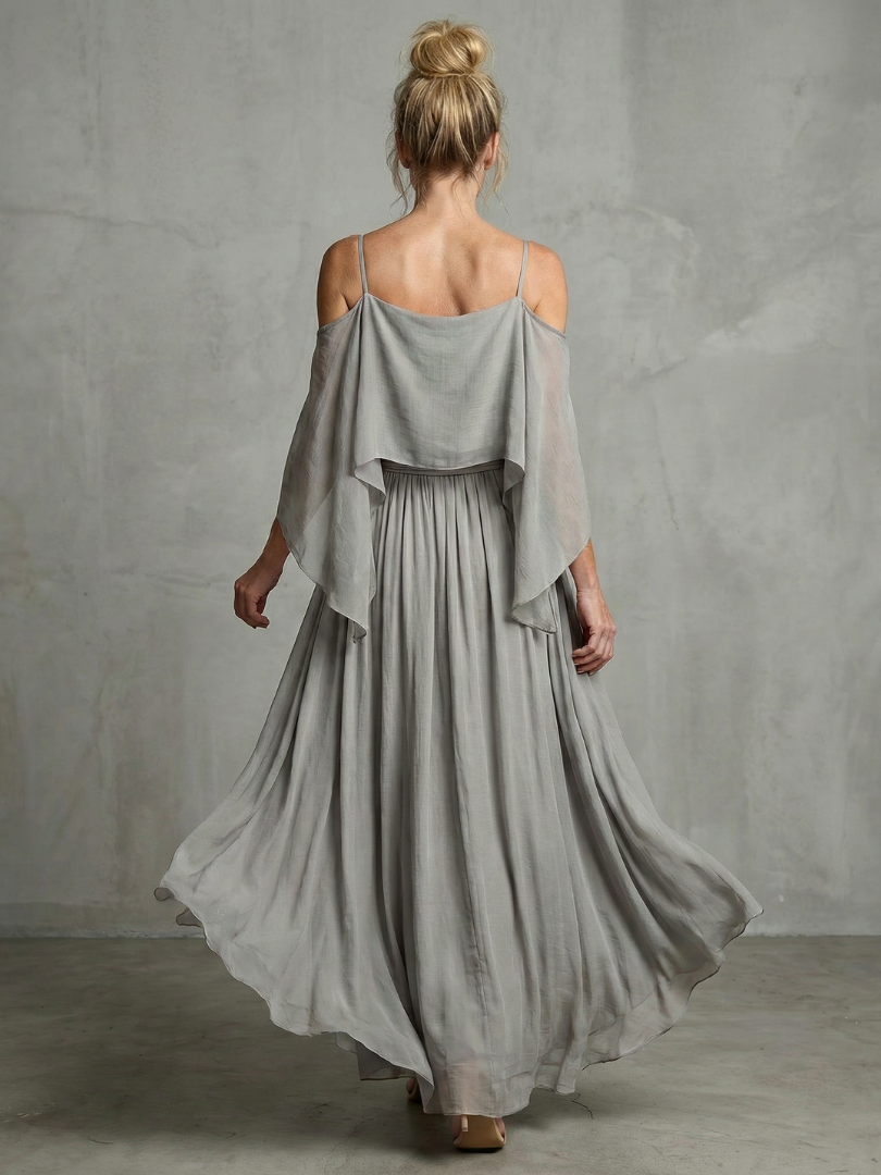 Close-up of women's grey layered drape cold shoulder top & flowy wide leg pants set. Perfect for casual wear.