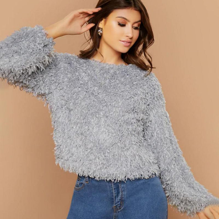Comfortable women's round neck plush sweater, soft and cozy, great for casual winter outfits.