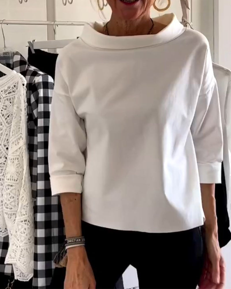 Women's elegant 3/4 sleeve collared blouse for office wear or casual chic spring outfits.