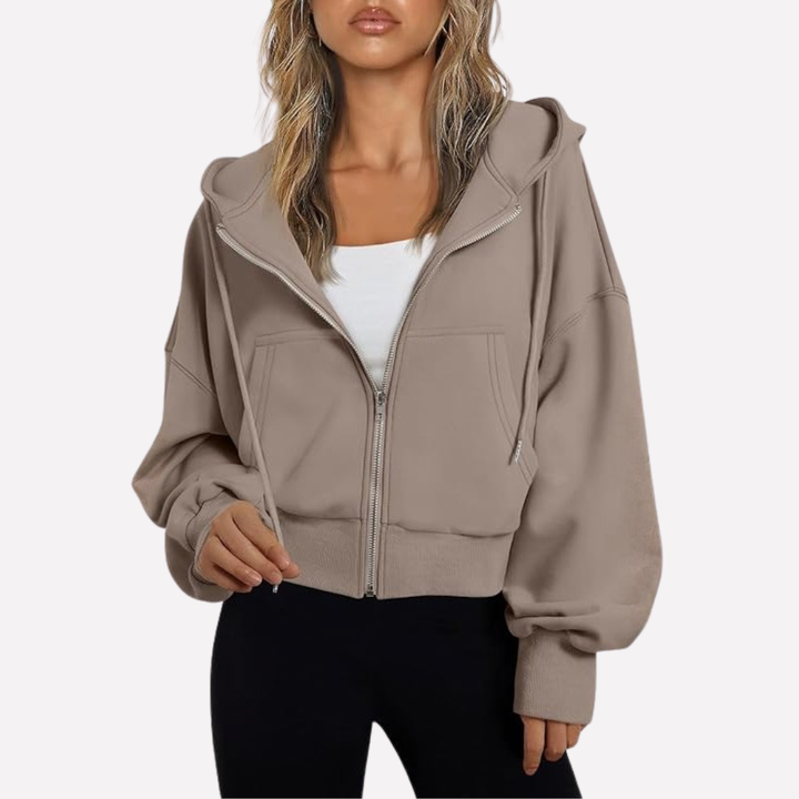 Relaxed fit women's cropped zip hoodie, a versatile layering piece for fashion.
