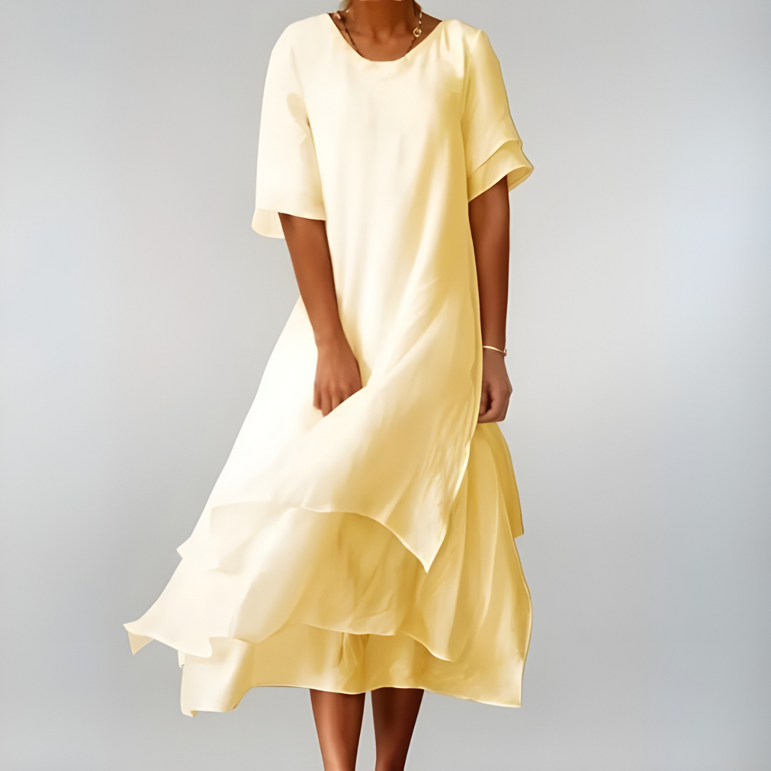 Graceful white flowing long dress for women. Elegant, lightweight, and comfortable, suitable for summer events.