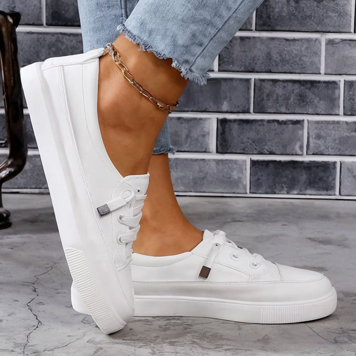 Slip-resistant women's walking shoes, comfortable sneakers with arch support for active daily wear.