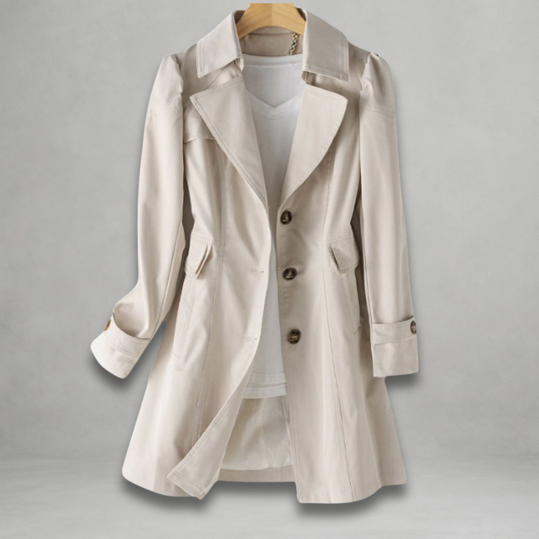 Close-up of lightweight women's trench coat showing button front, lapels & durable spring jacket fabric.