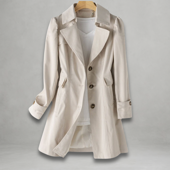Close-up of lightweight women's trench coat showing button front, lapels & durable spring jacket fabric.