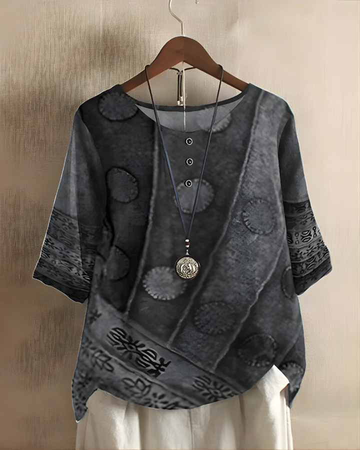 Casual women's blouse featuring a vibrant print, great for everyday comfort.