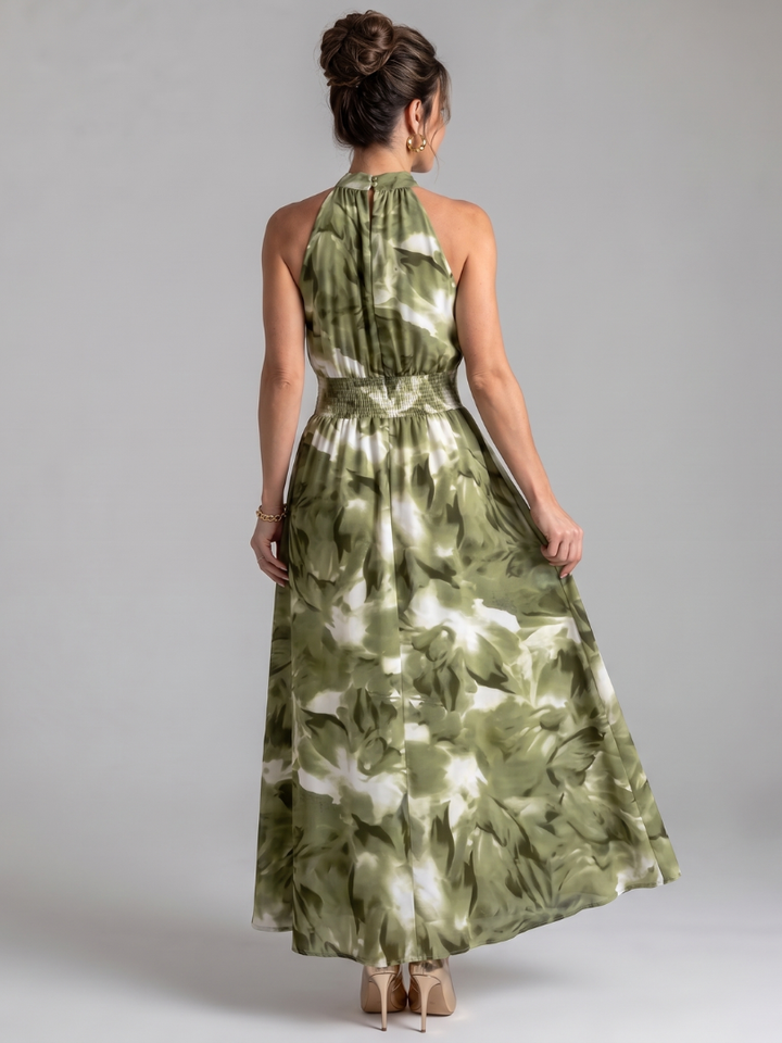 Casual women's abstract print midi dress with a chic gathered waist. Versatile summer and vacation fashion.
