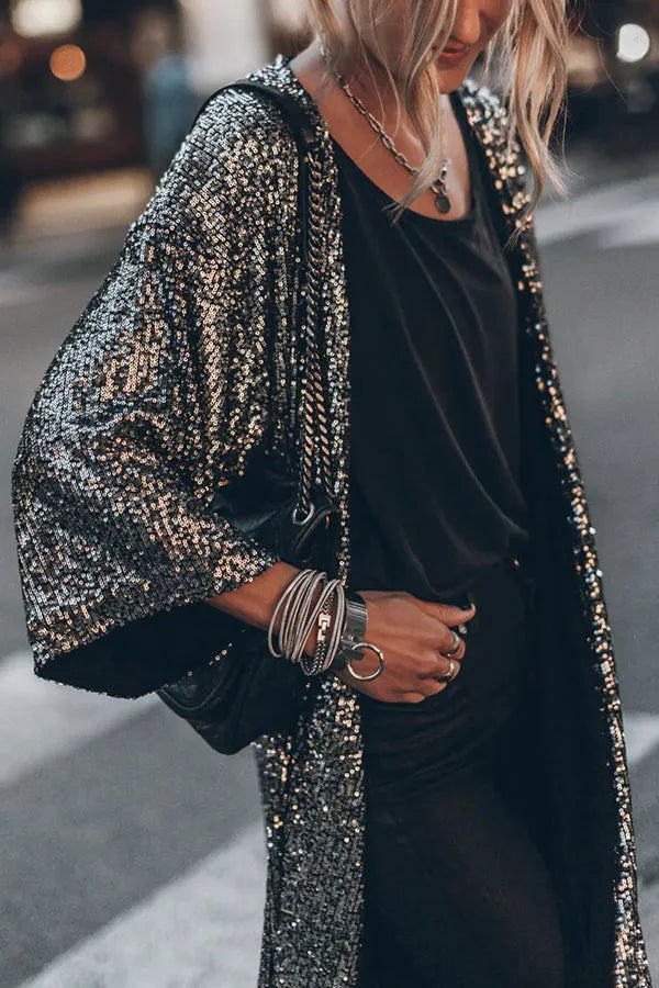 Glamorous women's sequined kimono, a dazzling statement piece for parties and elegant evening wear.
