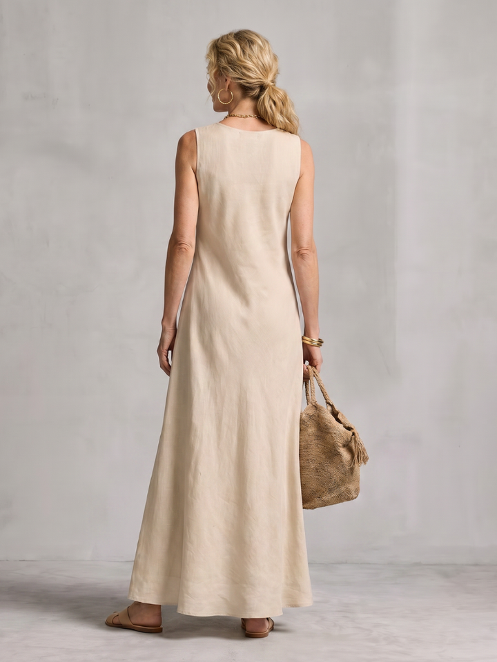 Stylish sleeveless women's maxi dress with a unique asymmetric layered design and flowy fabric.