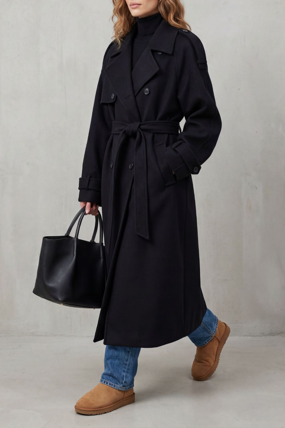 Effortless style: women's black oversized trench coat. Chic outerwear, a versatile long jacket for autumn fashion.