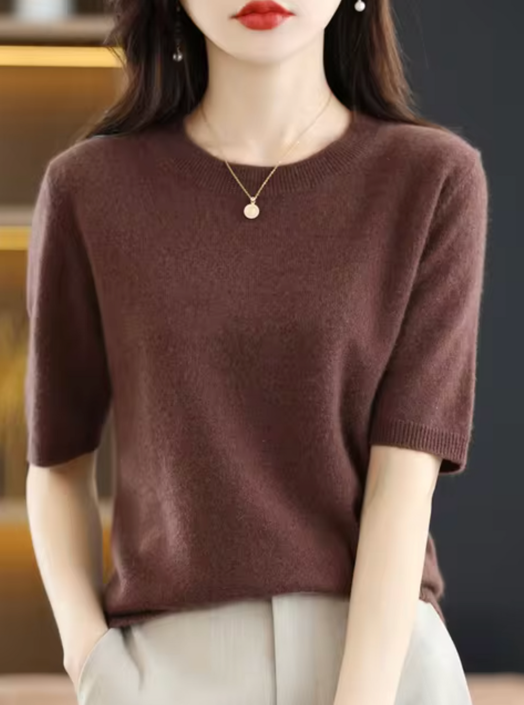 Cozy short-sleeved knit top for women. Chic, elegant, and perfect for modern everyday wear.