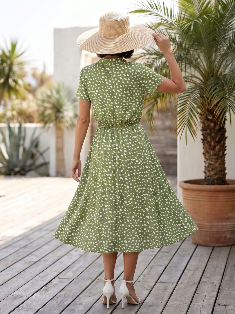 Detailed view of the button-front closure on a women's casual printed midi dress, versatile for any occasion.