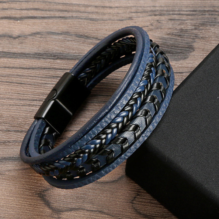Men's braided leather bracelet featuring a secure magnetic clasp & Viking aesthetic.