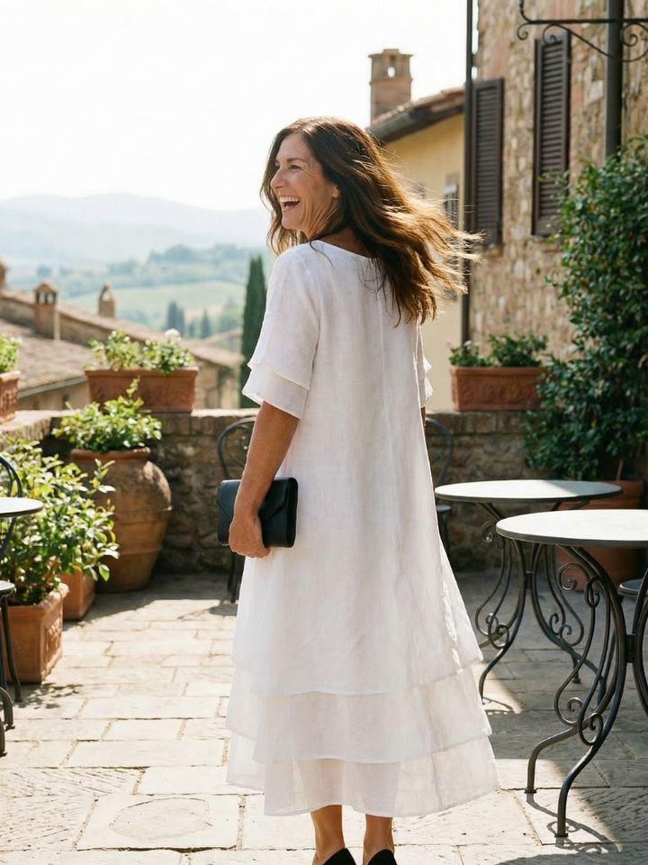 Stylish women's summer midi dress, featuring soft layers and a flowy silhouette for effortless style.