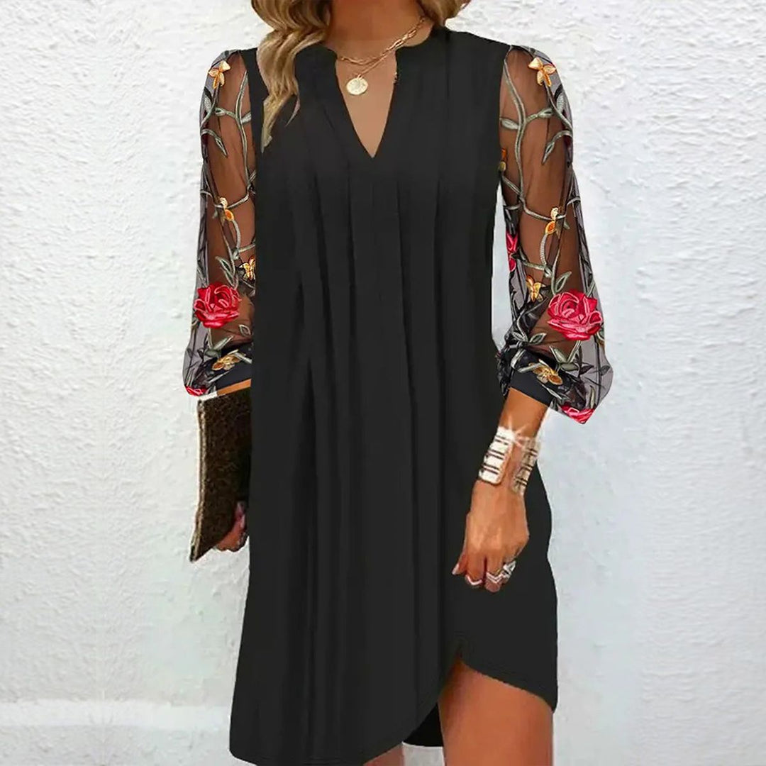Elegant black V-neck dress for women, featuring intricate floral embroidered sleeves, perfect for evening or party wear.