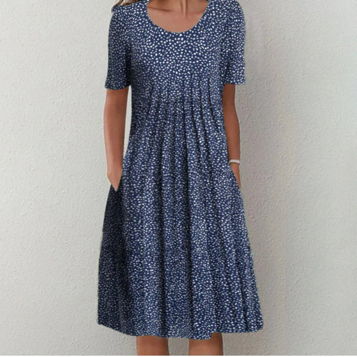 Chic women's summer dress with a flattering flowy fit and elegant design.
