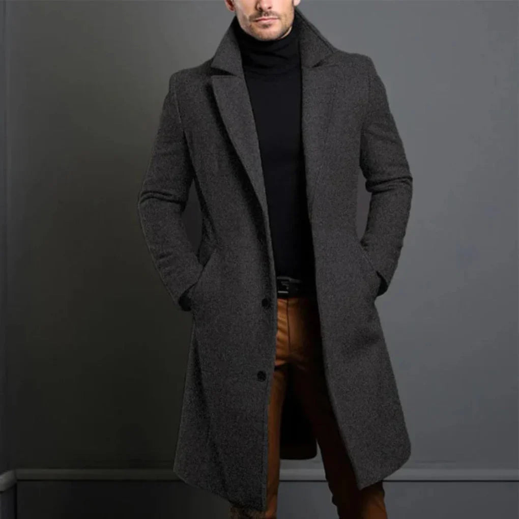 Modern men's longline overcoat with a sophisticated design for elegant fall and winter fashion.