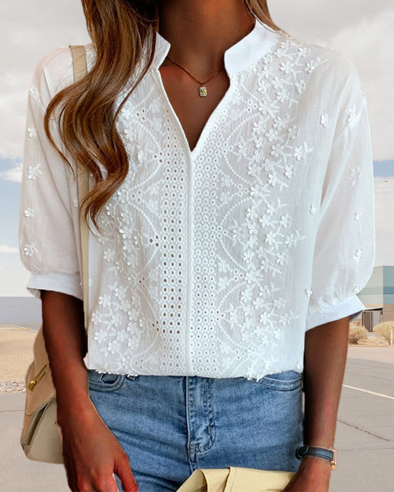 Comfortable lightweight white puff sleeve V-neck blouse, perfect for warm summer days.