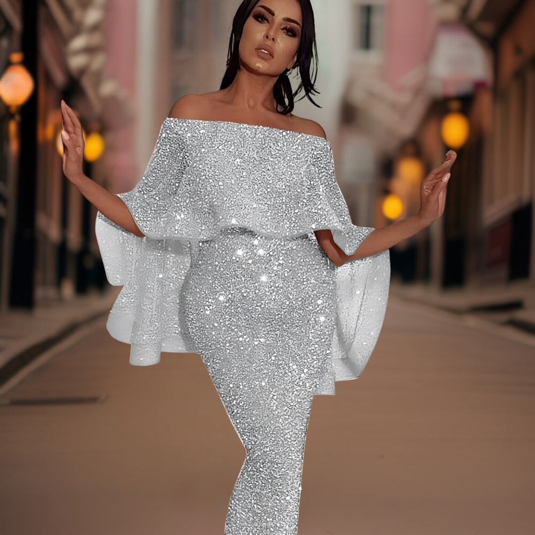 Close-up of the delicate ruffles & off-shoulder neckline on this elegant women's party dress.