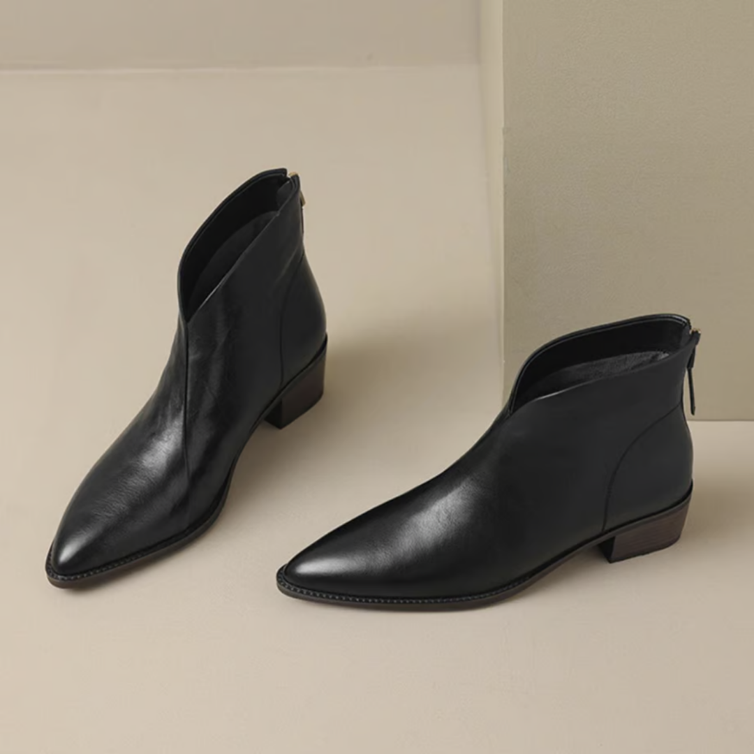 Comfortable black slip-on ankle boots for women, versatile and elegant fall footwear.