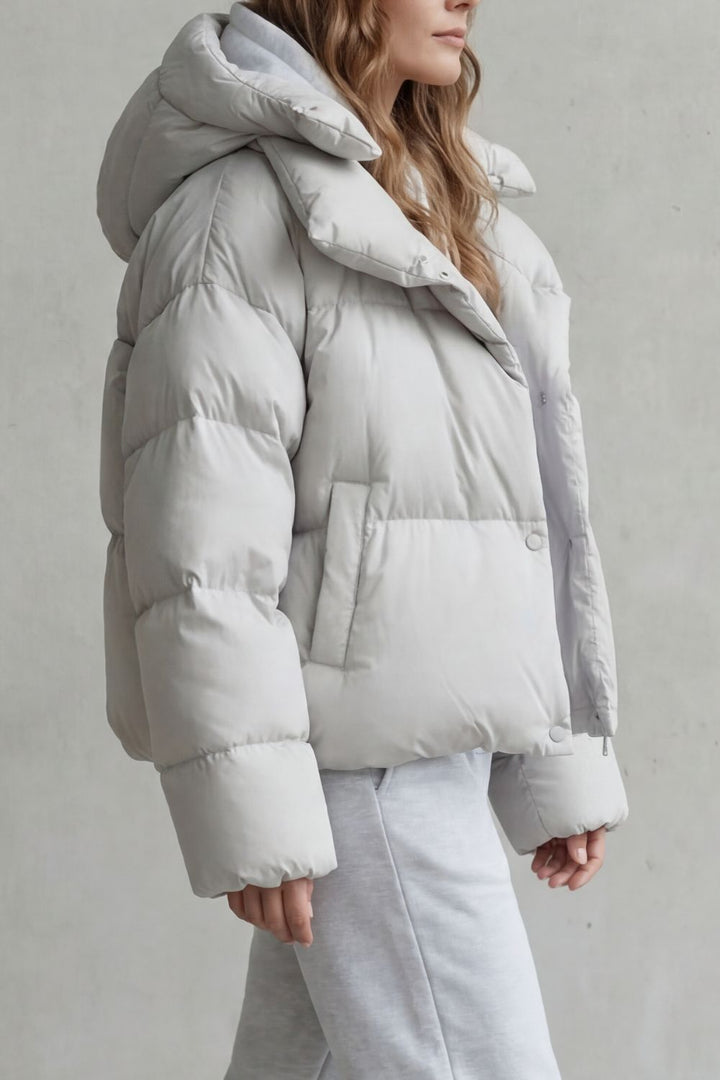 Warm women's cropped puffer jacket with cloud-soft feel, perfect for cozy winter outerwear.
