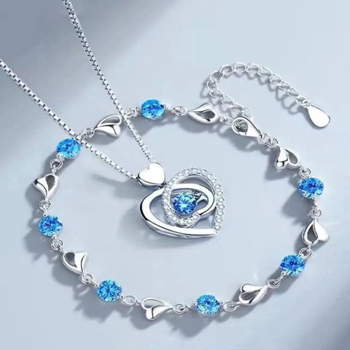 Elegant women's 925 sterling silver heart necklace & bracelet set, perfect gift for her. Blue accents.